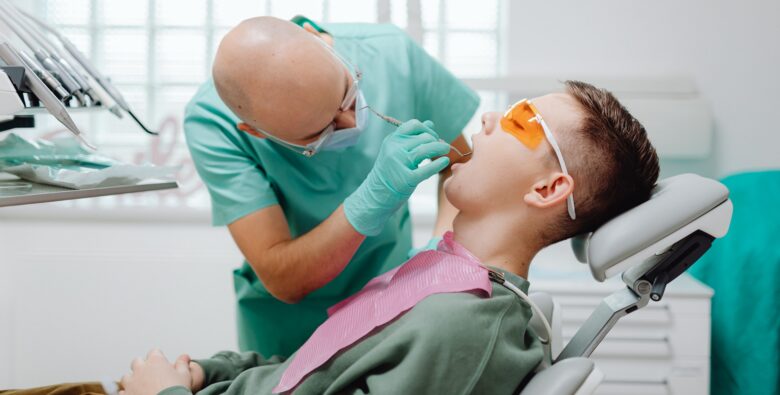https://www.pexels.com/photo/a-dentist-checking-a-patient-s-teeth-6627422/